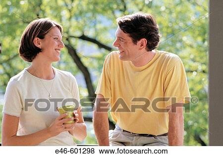Couple relaxing, outdoors View Large Photo Image Stock Photo - Couple relaxing, outdoors. Fotosearch