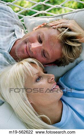 Stock Image - couple relaxing. Fotosearch