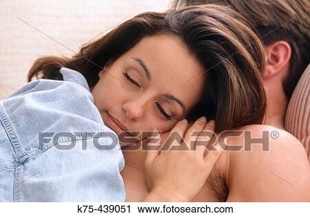 Couple relaxing together View Large Photo Image Stock Image - Couple relaxing together. Fotosearch