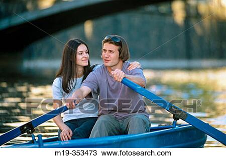 Stock Image - couple rowing together. Fotosearch
