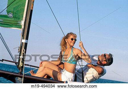 couple sailing View Large Photo Image Picture - couple sailing. Fotosearch