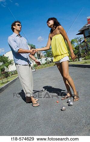 couple shaking hands after playing bocci View Large Photo Image Stock Photo - couple shaking hands after playing bocci. Fotosearch