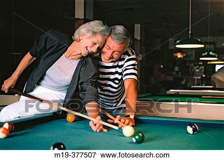 couple shooting pool (billards) View Large Photo Image Stock Photo - couple shooting pool (billards). Fotosearch