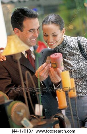 Couple shopping at a gift shop View Large Photo Image Stock Photo - Couple shopping at a gift shop. Fotosearch