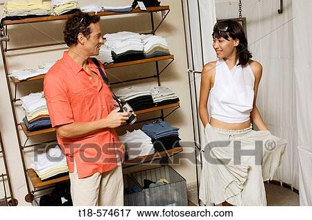 Stock Photo - couple shopping at store. Fotosearch