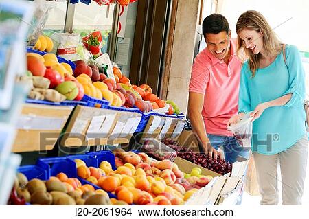 Couple shopping. Buying in Fruit Shop. San Sebastian. Donostia. Gipuzkoa. Basque Country. Spain. View Large Photo Image Picture - Couple shopping. Buying in Fruit Shop. San Sebastian. Donostia. Gipuzkoa. Basque Country. Spain.. Fotosearch