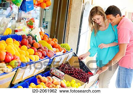 Couple shopping. Buying in Fruit Shop. San Sebastian. Donostia. Gipuzkoa. Basque Country. Spain. View Large Photo Image Stock Image - Couple shopping. Buying in Fruit Shop. San Sebastian. Donostia. Gipuzkoa. Basque Country. Spain.. Fotosearch