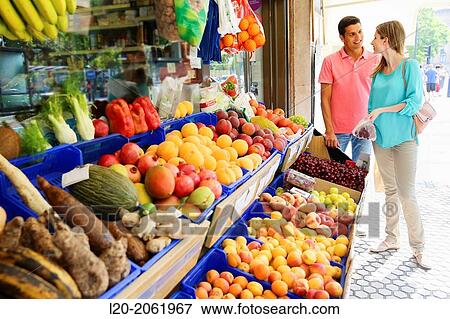 Couple shopping. Buying in Fruit Shop. San Sebastian. Donostia. Gipuzkoa. Basque Country. Spain. View Large Photo Image Stock Photo - Couple shopping. Buying in Fruit Shop. San Sebastian. Donostia. Gipuzkoa. Basque Country. Spain.. Fotosearch