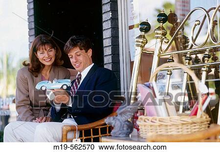 Stock Image - couple shopping for antiques. Fotosearch