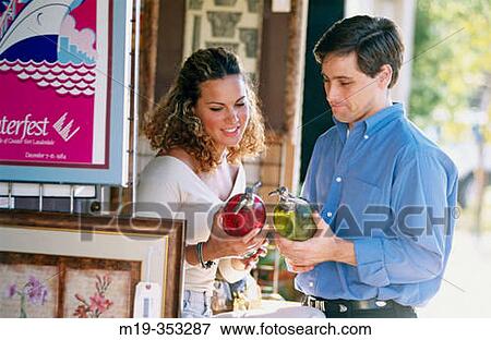Stock Photo - couple shopping for antiques. Fotosearch