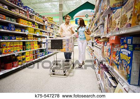 couple shopping in supermarket View Large Photo Image Stock Photo - couple shopping in supermarket. Fotosearch