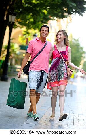 Couple shopping. Plaza de Gipuzkoa. San Sebastian. Donostia. Gipuzkoa. Basque Country. Spain. View Large Photo Image Picture - Couple shopping. Plaza de Gipuzkoa. San Sebastian. Donostia. Gipuzkoa. Basque Country. Spain.. Fotosearch