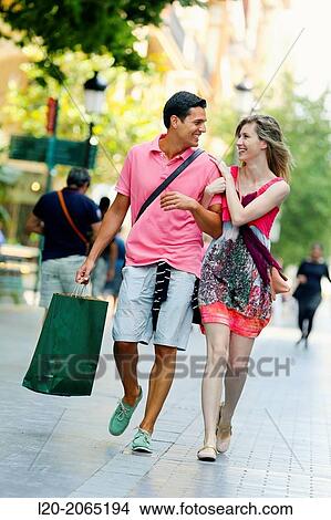 Couple shopping. Plaza de Gipuzkoa. San Sebastian. Donostia. Gipuzkoa. Basque Country. Spain. View Large Photo Image Picture - Couple shopping. Plaza de Gipuzkoa. San Sebastian. Donostia. Gipuzkoa. Basque Country. Spain.. Fotosearch