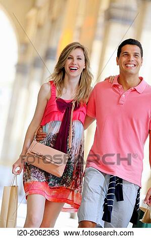 Couple shopping. Plaza de Gipuzkoa. San Sebastian. Donostia. Gipuzkoa. Basque Country. Spain. View Large Photo Image Stock Image - Couple shopping. Plaza de Gipuzkoa. San Sebastian. Donostia. Gipuzkoa. Basque Country. Spain.. Fotosearch