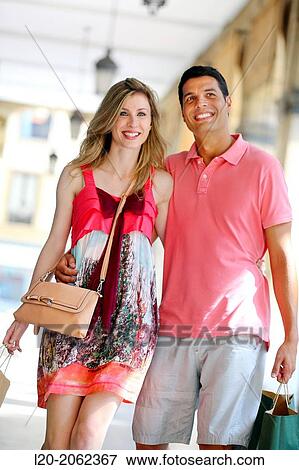 Couple shopping. Plaza de Gipuzkoa. San Sebastian. Donostia. Gipuzkoa. Basque Country. Spain. View Large Photo Image Stock Photo - Couple shopping. Plaza de Gipuzkoa. San Sebastian. Donostia. Gipuzkoa. Basque Country. Spain.. Fotosearch