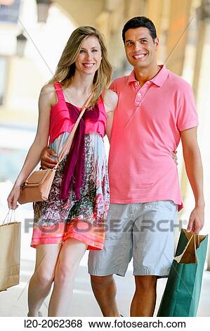 Couple shopping. Plaza de Gipuzkoa. San Sebastian. Donostia. Gipuzkoa. Basque Country. Spain. View Large Photo Image Stock Photo - Couple shopping. Plaza de Gipuzkoa. San Sebastian. Donostia. Gipuzkoa. Basque Country. Spain.. Fotosearch