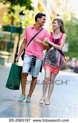Couple shopping. Plaza de Gipuzkoa. San Sebastian. Donostia. Gipuzkoa. Basque Country. Spain. View Large Photo Image Stock Photo - Couple shopping. Plaza de Gipuzkoa. San Sebastian. Donostia. Gipuzkoa. Basque Country. Spain.. Fotosearch