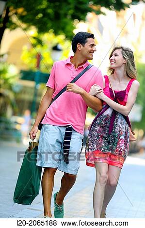 Couple shopping. Plaza de Gipuzkoa. San Sebastian. Donostia. Gipuzkoa. Basque Country. Spain. View Large Photo Image Stock Photo - Couple shopping. Plaza de Gipuzkoa. San Sebastian. Donostia. Gipuzkoa. Basque Country. Spain.. Fotosearch
