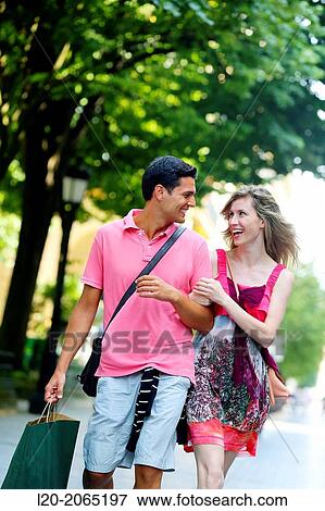 Couple shopping. Plaza de Gipuzkoa. San Sebastian. Donostia. Gipuzkoa. Basque Country. Spain. View Large Photo Image Stock Photo - Couple shopping. Plaza de Gipuzkoa. San Sebastian. Donostia. Gipuzkoa. Basque Country. Spain.. Fotosearch