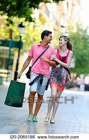 Couple shopping. Plaza de Gipuzkoa. San Sebastian. Donostia. Gipuzkoa. Basque Country. Spain. View Large Photo Image Stock Photograph - Couple shopping. Plaza de Gipuzkoa. San Sebastian. Donostia. Gipuzkoa. Basque Country. Spain.. Fotosearch