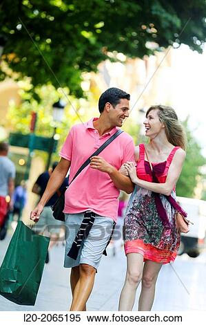 Couple shopping. Plaza de Gipuzkoa. San Sebastian. Donostia. Gipuzkoa. Basque Country. Spain. View Large Photo Image Stock Photography - Couple shopping. Plaza de Gipuzkoa. San Sebastian. Donostia. Gipuzkoa. Basque Country. Spain.. Fotosearch