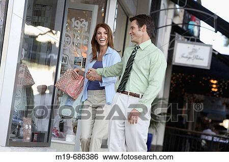 Couple shopping View Large Photo Image Stock Photograph - Couple shopping. Fotosearch