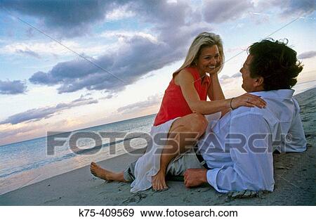 couple showing affection on the beach View Large Photo Image Stock Photo - couple showing affection on the beach. Fotosearch