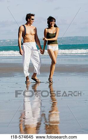 couple sightseeing on beach View Large Photo Image Stock Photography - couple sightseeing on beach. Fotosearch
