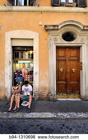 Couple siting in a doorway. Rome. Italy. View Large Photo Image Stock Photo - Couple siting in a doorway. Rome. Italy.. Fotosearch