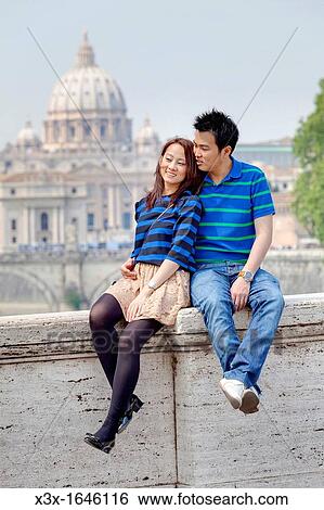 Couple sitting in front of Saint Peter's Cathedral Vatican Rome Italy View Large Photo Image Stock Photograph - Couple sitting in front of Saint Peter's Cathedral Vatican Rome Italy. Fotosearch