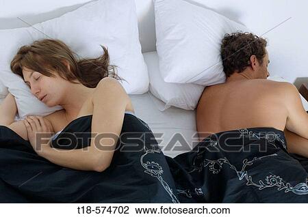 couple sleeping in bed View Large Photo Image Stock Image - couple sleeping in bed. Fotosearch