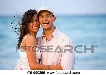 Couple smiling and hugging. View Large Photo Image Stock Photography - Couple smiling and hugging.. Fotosearch