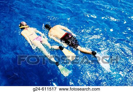 Couple snorkeling, Caribbean View Large Photo Image Stock Photo - Couple snorkeling, Caribbean. Fotosearch