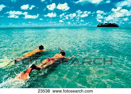 Stock Photo - Couple snorkeling. Cook Islands. Fotosearch