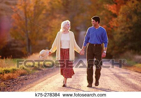 couple strolling country road View Large Photo Image Picture - couple strolling country road. Fotosearch