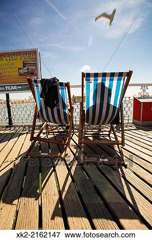 Couple suntanning in hammock, Brighton, UK View Large Photo Image Stock Photo - Couple suntanning in hammock, Brighton, UK. Fotosearch