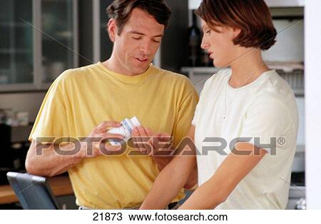 Couple, taking vitamins View Large Photo Image Stock Image - Couple, taking vitamins. Fotosearch
