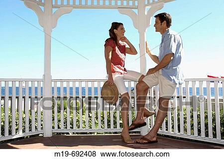 Couple talking in a Gazebo View Large Photo Image Stock Photo - Couple talking in a Gazebo. Fotosearch