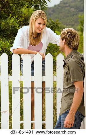 Couple talking in the garden View Large Photo Image Stock Image - Couple talking in the garden. Fotosearch