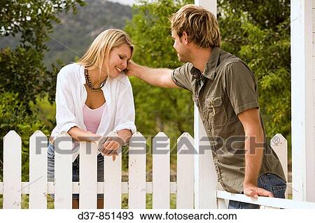 Couple talking with affection in the garden View Large Photo Image Stock Image - Couple talking with affection in the garden. Fotosearch