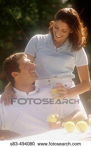 Stock Image - Couple, tennis. Fotosearch