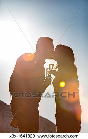 Couple toasting together View Large Photo Image Stock Photo - Couple toasting together. Fotosearch