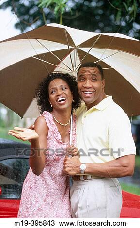 couple under an umbrella View Large Photo Image Stock Image - couple under an umbrella. Fotosearch