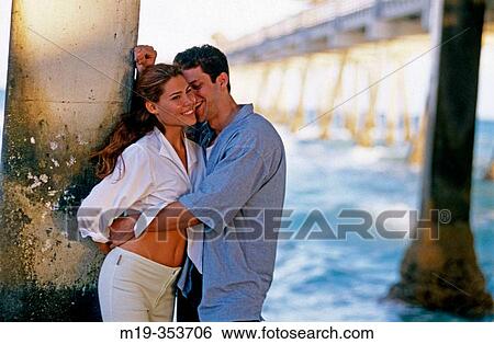 Couple under pier View Large Photo Image Stock Photograph - Couple under pier. Fotosearch