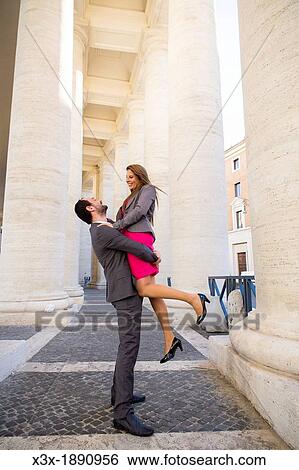 Couple under the colonnade of Saint Peter's cathedral Vatican Rome Italy View Large Photo Image Stock Photograph - Couple under the colonnade of Saint Peter's cathedral Vatican Rome Italy. Fotosearch