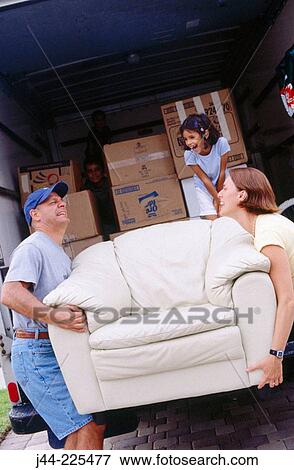 Couple unloading furniture from moving truck View Large Photo Image Stock Photo - Couple unloading furniture from moving truck. Fotosearch