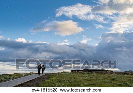 Couple walking around Gulfoss waterfall area, Iceland View Large Photo Image Stock Photo - Couple walking around Gulfoss waterfall area, Iceland. Fotosearch