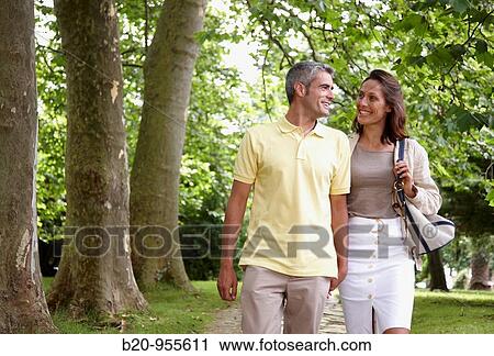 Couple walking in a garden, spa-relais. Lierganes hotel and spa, Cantabria, Spain View Large Photo Image Stock Image - Couple walking in a garden, spa-relais. Lierganes hotel and spa, Cantabria, Spain. Fotosearch
