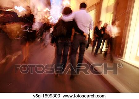 couple walking in street at night in rome italy View Large Photo Image Stock Image - couple walking in street at night in rome italy. Fotosearch