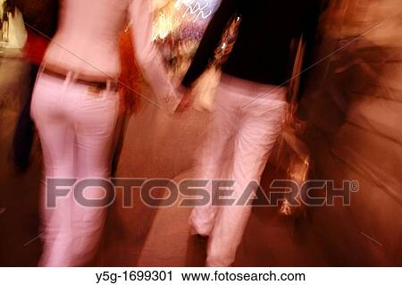 couple walking in street at night in rome italy View Large Photo Image Stock Image - couple walking in street at night in rome italy. Fotosearch